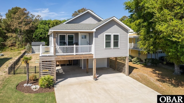 51 Skyline Rd Lot 6, Southern Shores, NC 27949 - coastal inspired home with a carport, concrete driveway, stairway, a garage, and roof with shingles