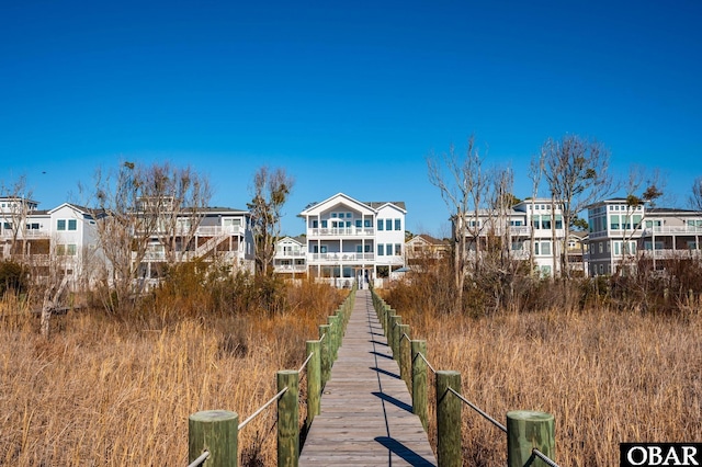 back of property featuring a residential view