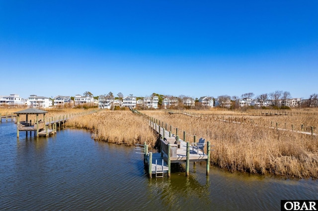 dock area featuring a water view and boat lift