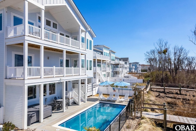 view of pool with a patio area, fence, and a fenced in pool