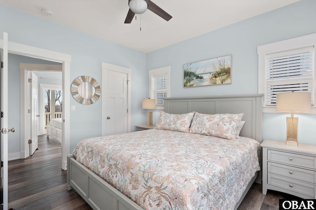 bedroom featuring dark wood finished floors and a ceiling fan