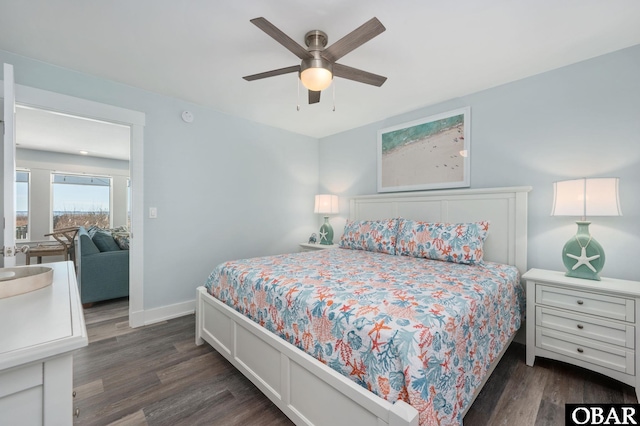 bedroom featuring dark wood-style floors, baseboards, and a ceiling fan