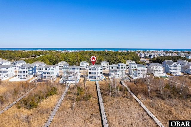 aerial view featuring a water view and a residential view