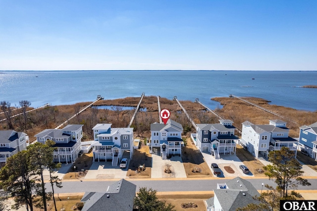 aerial view with a residential view and a water view