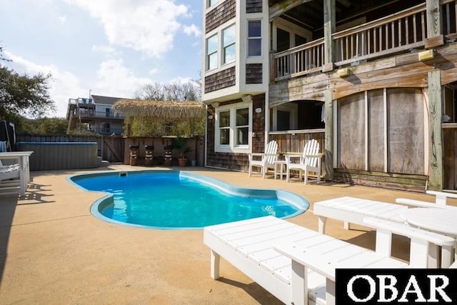 view of pool featuring a patio area, a fenced in pool, and fence