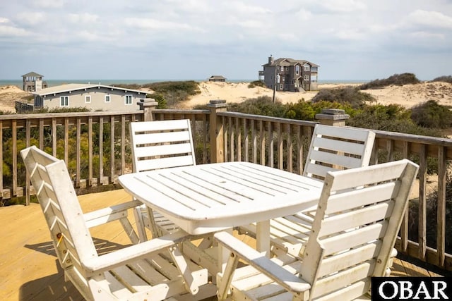 wooden deck featuring outdoor dining area