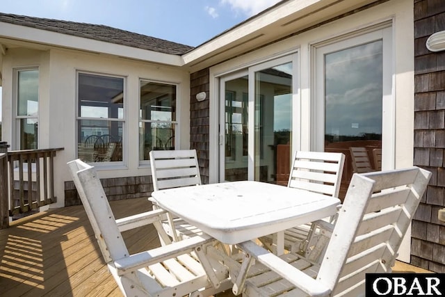 deck with outdoor dining space