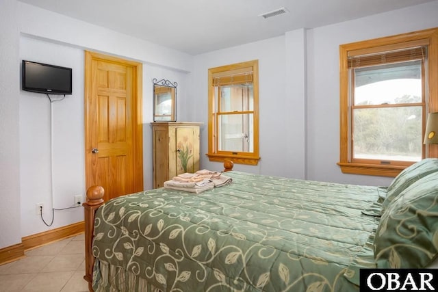 bedroom with tile patterned flooring, baseboards, and visible vents