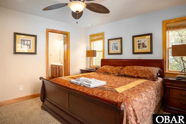 bedroom with visible vents, a ceiling fan, connected bathroom, carpet flooring, and baseboards