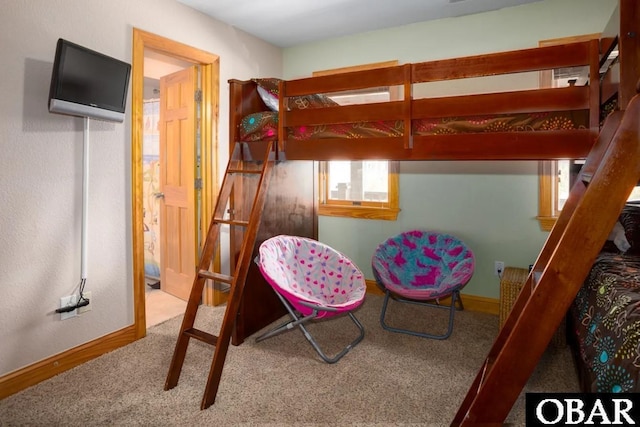 bedroom featuring baseboards and carpet floors