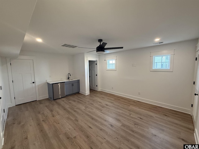 615 W Aycock St Unit 5-7, Kill Devil Hills, NC 27948 - below grade area with a sink, a ceiling fan, wood finished floors, baseboards, and recessed lighting