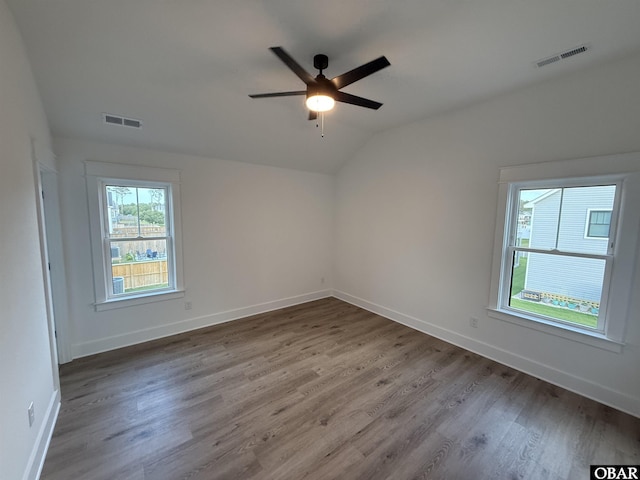 615 W Aycock St Unit 5-7, Kill Devil Hills, NC 27948 - empty room featuring a ceiling fan, lofted ceiling, wood finished floors, and baseboards