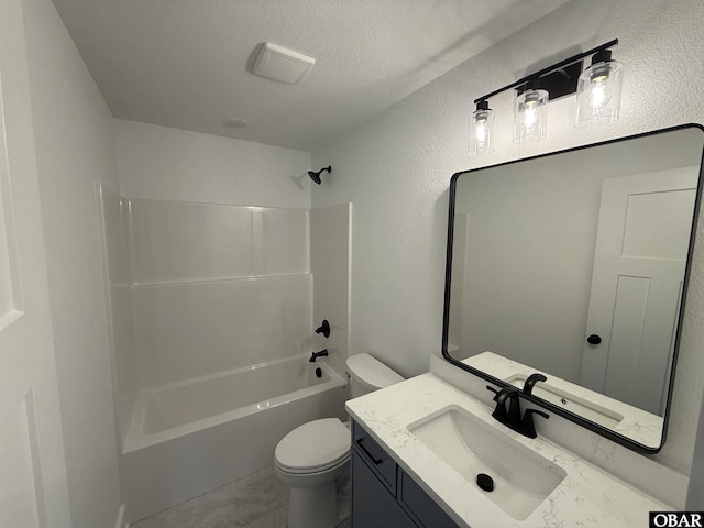 615 W Aycock St Unit 5-7, Kill Devil Hills, NC 27948 - full bath featuring toilet, vanity, marble finish flooring, washtub / shower combination, and a textured ceiling