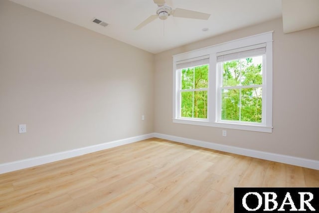 105D Colington Pointe Cir Unit 104-D, Kill Devil Hills, NC 27948 - spare room with wood finished floors and a ceiling fan
