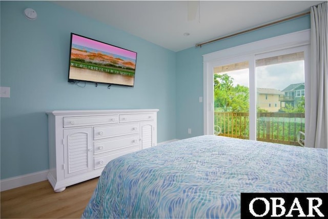 105D Colington Pointe Cir Unit 104-D, Kill Devil Hills, NC 27948 - bedroom featuring wood finished floors, access to outside, and a ceiling fan