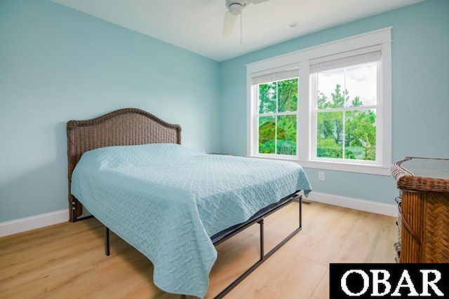 105D Colington Pointe Cir Unit 104-D, Kill Devil Hills, NC 27948 - bedroom with light wood-type flooring and a ceiling fan