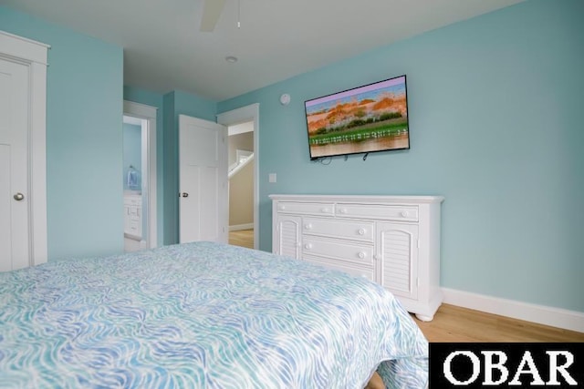 105D Colington Pointe Cir Unit 104-D, Kill Devil Hills, NC 27948 - bedroom featuring light wood-style flooring and a ceiling fan