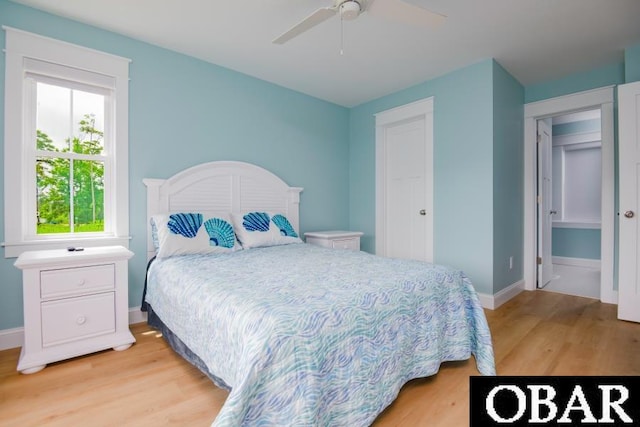 105D Colington Pointe Cir Unit 104-D, Kill Devil Hills, NC 27948 - bedroom with light wood-style floors and a ceiling fan