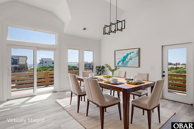 2002 Sandpiper Rd Lot 12, Corolla, NC 27927 - dining space with high vaulted ceiling and light wood finished floors