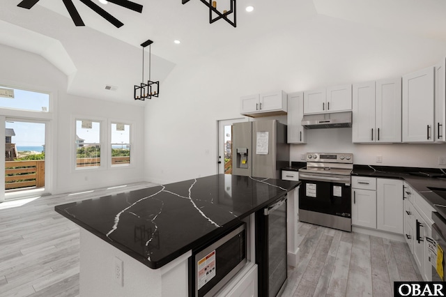 2002 Sandpiper Rd Lot 12, Corolla, NC 27927 - kitchen with appliances with stainless steel finishes, under cabinet range hood, beverage cooler, a ceiling fan, and light wood-style floors