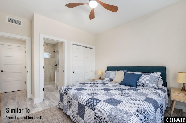 bedroom featuring visible vents, a ceiling fan, ensuite bathroom, light wood-style floors, and a closet