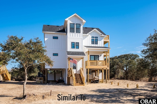 view of front facade featuring a shingled roof, dirt driveway, a carport, stairs, and board and batten siding