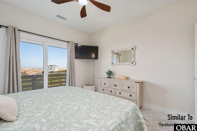 bedroom with a ceiling fan, wood finished floors, visible vents, and baseboards