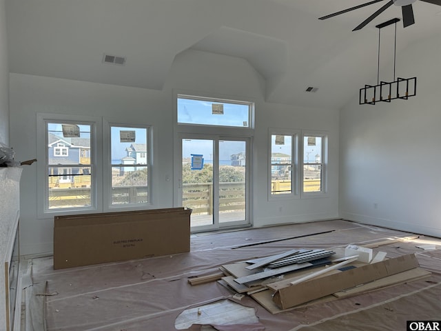 unfurnished room featuring high vaulted ceiling, visible vents, and a ceiling fan