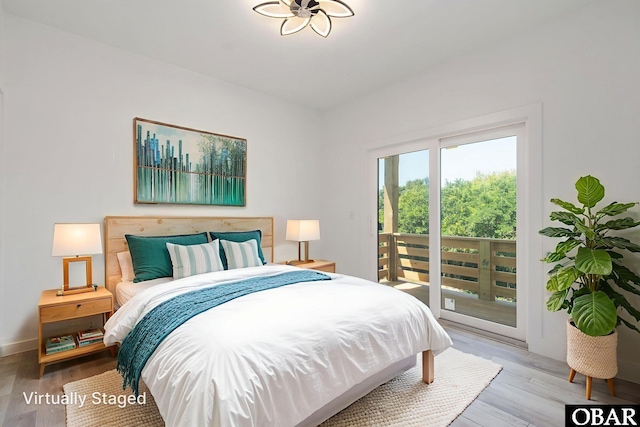 2002 Sandpiper Rd Lot 12, Corolla, NC 27927 - bedroom with access to exterior and wood finished floors