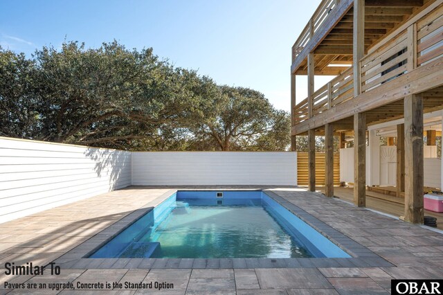 view of pool featuring fence