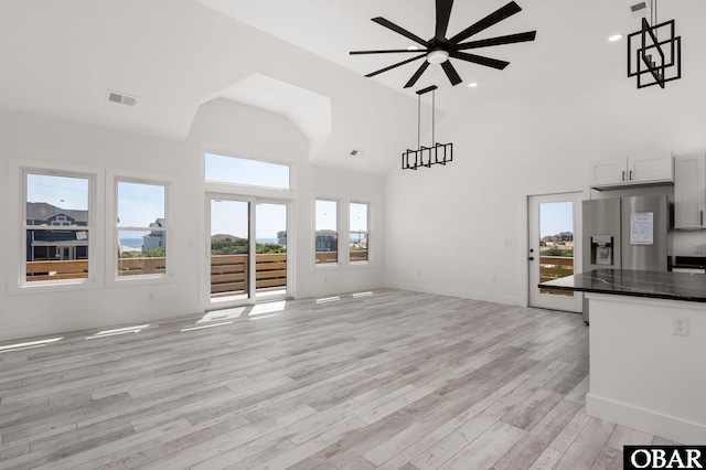 2002 Sandpiper Rd Lot 12, Corolla, NC 27927 - unfurnished living room featuring high vaulted ceiling, a ceiling fan, light wood-style flooring, and recessed lighting