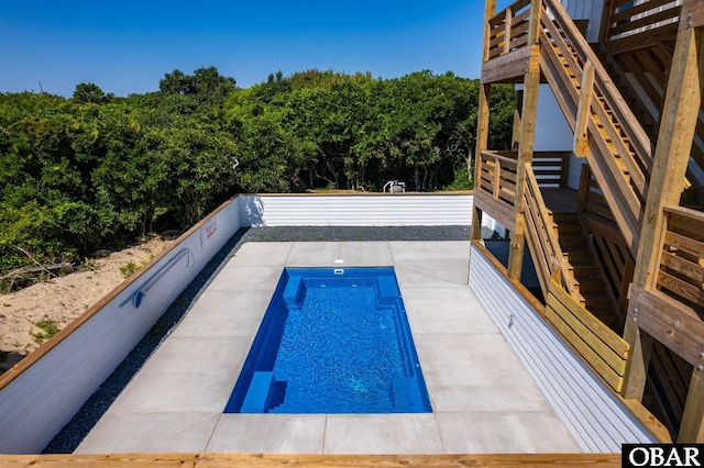2002 Sandpiper Rd Lot 12, Corolla, NC 27927 - view of swimming pool with stairs and a wooden deck