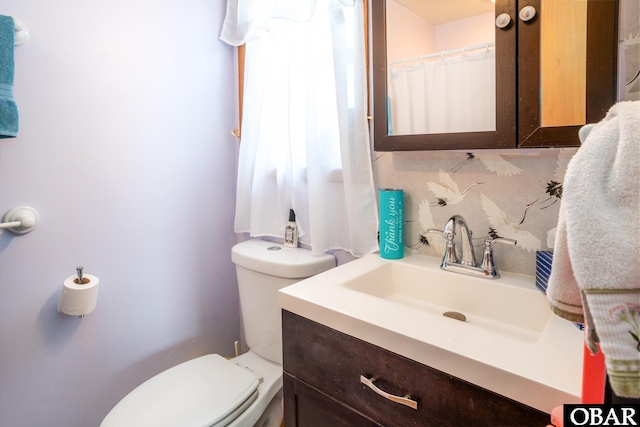 full bathroom with vanity and toilet
