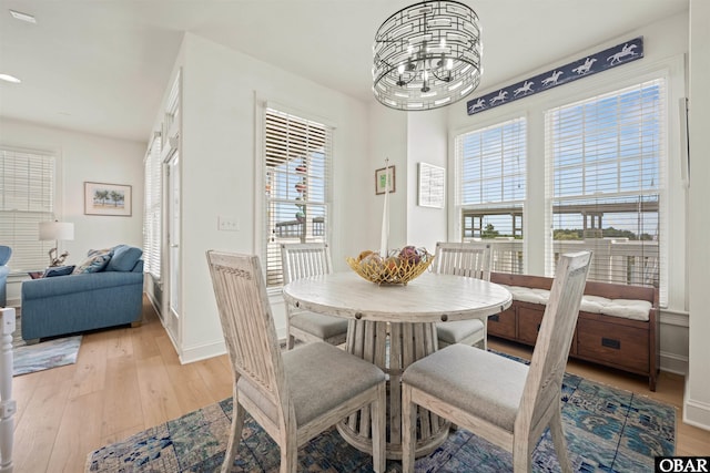 403 Sailfish Dr Unit 403, Manteo, NC 27954 - dining area featuring light wood-style floors, a chandelier, and baseboards