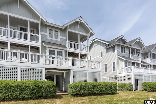 403 Sailfish Dr Unit 403, Manteo, NC 27954 - rear view of house with board and batten siding and roof with shingles