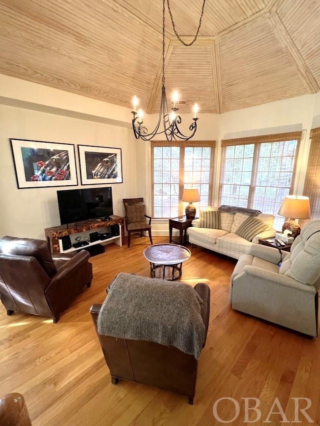 living room with wood finished floors, wood ceiling, lofted ceiling, and an inviting chandelier