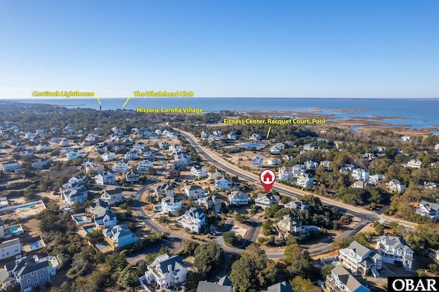 birds eye view of property featuring a water view and a residential view