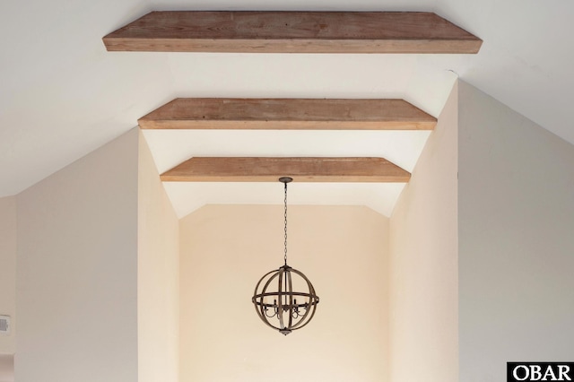 room details featuring a notable chandelier and beam ceiling