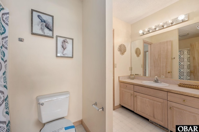 full bath featuring baseboards, toilet, tile patterned floors, a textured ceiling, and vanity