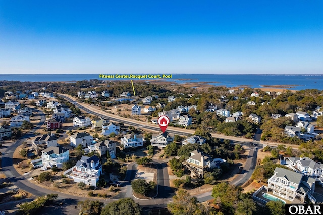 bird's eye view with a residential view and a water view