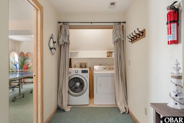 laundry room with light carpet, laundry area, visible vents, baseboards, and washing machine and dryer