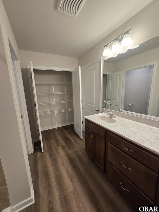 120 Dailey Rd Lot 1, Camden, NC 27921 - bathroom featuring vanity, wood finished floors, and visible vents