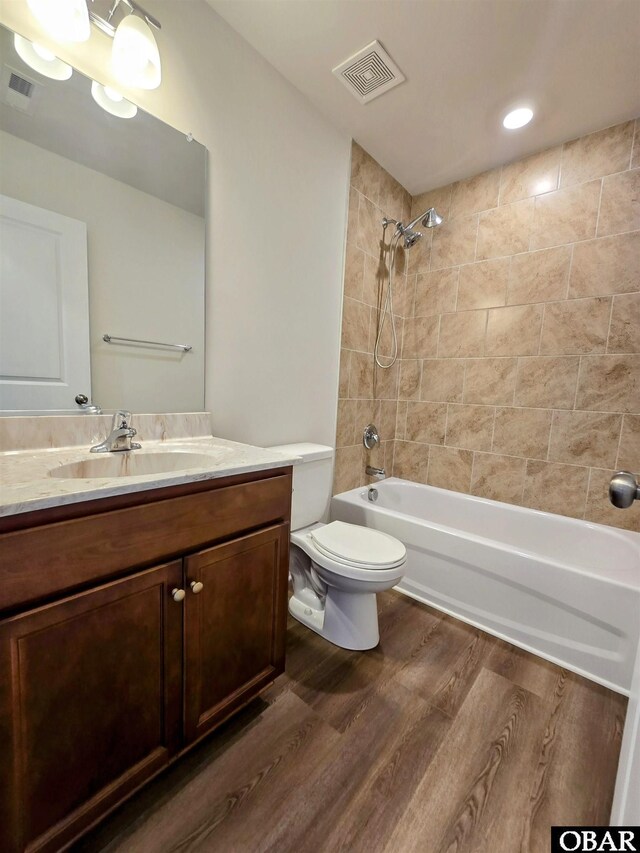 120 Dailey Rd Lot 1, Camden, NC 27921 - bathroom with vanity, shower / bathtub combination, toilet, wood finished floors, and visible vents