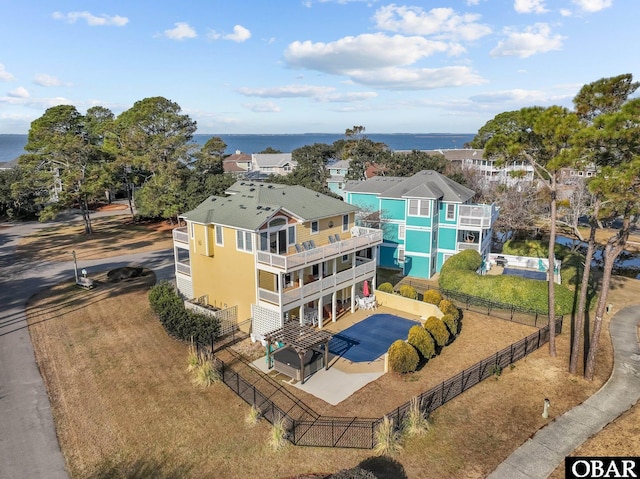 birds eye view of property featuring a water view