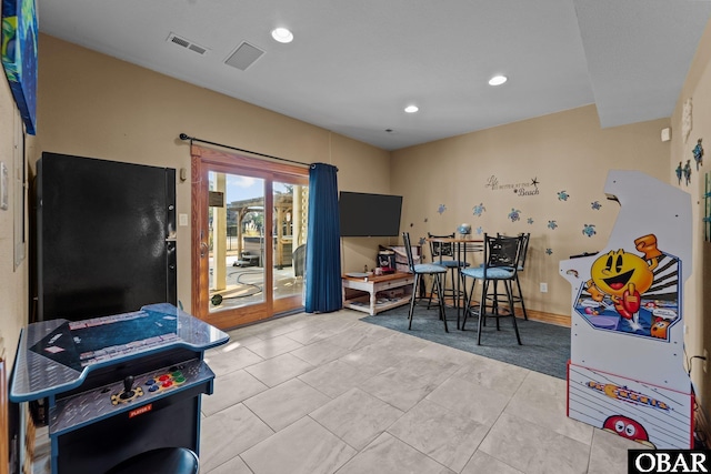 recreation room featuring baseboards, light tile patterned flooring, visible vents, and recessed lighting