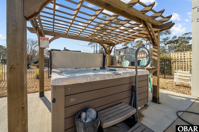 view of patio / terrace with a pergola, fence, and a hot tub