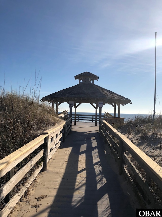 view of property's community featuring a water view and a gazebo