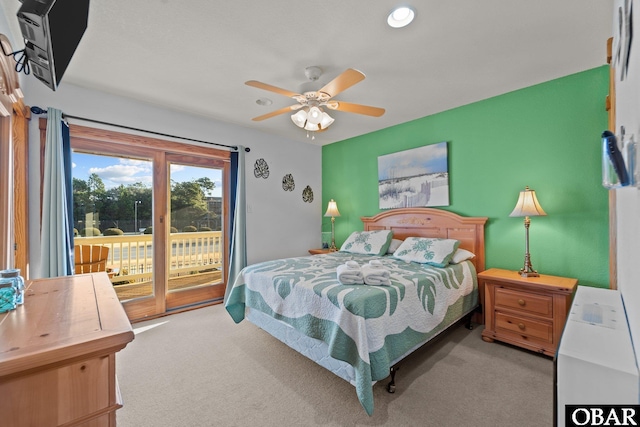 bedroom featuring light carpet, access to outside, and ceiling fan