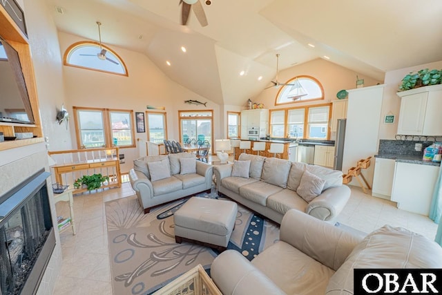 57390 Lighthouse Rd Lot 30, Hatteras, NC 27943 - living room with a ceiling fan, light tile patterned floors, a fireplace, recessed lighting, and high vaulted ceiling