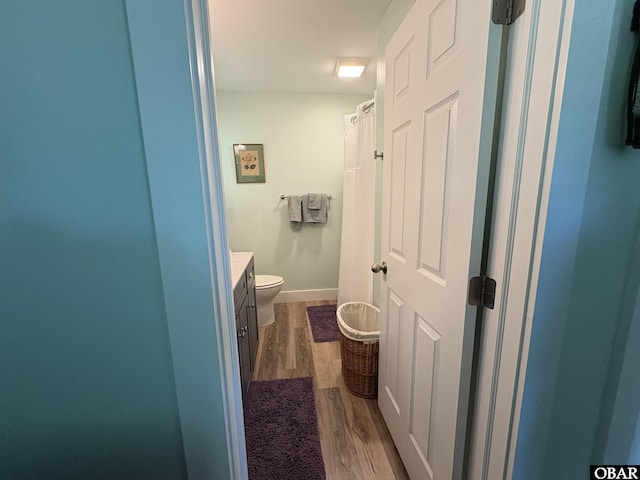 51 Fish Camp Rd, Ocracoke, NC 27960 - bathroom featuring vanity, toilet, and wood finished floors